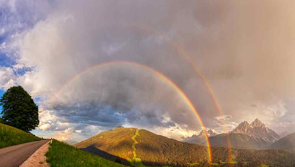 Doppelregenbogen Berglandschaft
